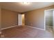 Spacious bedroom features plush carpet, and doorway into a closet offering plenty of storage space at 6610 Aberdeen Dr, McCordsville, IN 46055