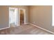 Cozy bedroom with plush carpet, two doors leading to a bathroom with shower and a walk-in closet at 6610 Aberdeen Dr, McCordsville, IN 46055