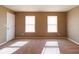 Bedroom with carpeting features two windows that provide ample natural light and neutral wall color at 6610 Aberdeen Dr, McCordsville, IN 46055