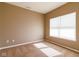 A neutral bedroom featuring carpet flooring and a large window at 6610 Aberdeen Dr, McCordsville, IN 46055