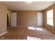 Spacious bedroom features neutral color walls, plush carpeting, and natural light from a window at 6610 Aberdeen Dr, McCordsville, IN 46055