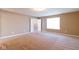 Neutral bedroom with plush carpet leading to bathroom and walk-in closet at 6610 Aberdeen Dr, McCordsville, IN 46055