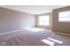 Spacious bedroom featuring neutral walls, carpet, and plenty of natural light from the windows at 6610 Aberdeen Dr, McCordsville, IN 46055
