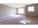 Large, sunny bedroom with neutral color scheme, plush carpeting, and bright natural light at 6610 Aberdeen Dr, McCordsville, IN 46055