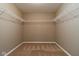 Walk-in closet with multiple shelving for storage and organization at 6610 Aberdeen Dr, McCordsville, IN 46055