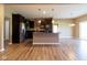 Spacious eat-in kitchen with modern stainless steel appliances, dark cabinets and a convenient breakfast bar at 6610 Aberdeen Dr, McCordsville, IN 46055