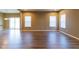 Open floor plan featuring vinyl flooring, abundant natural light, and access to the outdoors at 6610 Aberdeen Dr, McCordsville, IN 46055