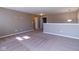 Spacious carpeted loft area with neutral paint, perfect for a recreation room or second living space at 6610 Aberdeen Dr, McCordsville, IN 46055