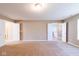 Spacious primary bedroom with plush carpet and adjoining bathroom and walk-in closet at 6610 Aberdeen Dr, McCordsville, IN 46055