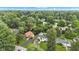 Aerial view of property showcasing landscaping, mature trees, and neighborhood at 6741 Evanston Ave, Indianapolis, IN 46220
