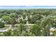 A high angle aerial view of neighborhood homes surrounded by mature, verdant trees on a beautiful summer day at 6741 Evanston Ave, Indianapolis, IN 46220