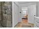 Open view from the shower, through the closet, and into the main bedroom at 6741 Evanston Ave, Indianapolis, IN 46220