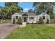 Charming home featuring classic architecture, a quaint front porch, and well-maintained landscaping at 6741 Evanston Ave, Indianapolis, IN 46220