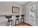 Kitchen counter seating with bar stools and view to outdoor space at 6741 Evanston Ave, Indianapolis, IN 46220