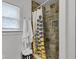 Stylish shower with a mosaic tile floor, stone-style tile walls, and a shower curtain at 6741 Evanston Ave, Indianapolis, IN 46220