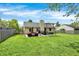 The backyard features a patio with outdoor seating, a swing, and well-maintained lawn at 6838 Cherry Laurel Ln, Fishers, IN 46038