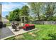 Backyard patio complete with outdoor seating, dining area, fire pit, swing, and grill at 6838 Cherry Laurel Ln, Fishers, IN 46038