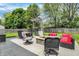 Backyard featuring patio with seating, dining area, fire pit, and swing at 6838 Cherry Laurel Ln, Fishers, IN 46038