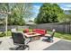 Backyard patio featuring outdoor seating, fire pit, swing, and well-kept lawn at 6838 Cherry Laurel Ln, Fishers, IN 46038