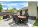 Backyard patio with outdoor seating, dining area, grill, and manicured lawn at 6838 Cherry Laurel Ln, Fishers, IN 46038