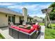 Backyard patio with outdoor seating, fire pit, swing, and manicured lawn at 6838 Cherry Laurel Ln, Fishers, IN 46038