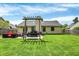Well-maintained backyard featuring a swing, patio, and outdoor seating area perfect for relaxation and entertaining at 6838 Cherry Laurel Ln, Fishers, IN 46038