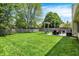 A fenced-in backyard featuring a patio with furniture and a swing for relaxing and outdoor activities at 6838 Cherry Laurel Ln, Fishers, IN 46038