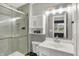 A modern bathroom featuring a glass shower, white cabinets, and modern fixtures at 6838 Cherry Laurel Ln, Fishers, IN 46038