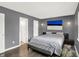 A modern bedroom featuring great natural light and hardwood floors at 6838 Cherry Laurel Ln, Fishers, IN 46038
