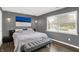 A modern bedroom featuring great natural light and hardwood floors at 6838 Cherry Laurel Ln, Fishers, IN 46038
