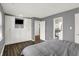 Spacious bedroom with a large window, closet, and hardwood floors at 6838 Cherry Laurel Ln, Fishers, IN 46038
