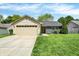 Charming ranch-style home featuring a two-car garage, neutral siding, and a well-maintained front lawn at 6838 Cherry Laurel Ln, Fishers, IN 46038