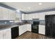 A bright kitchen featuring white cabinets, stainless steel appliances, and modern fixtures at 6838 Cherry Laurel Ln, Fishers, IN 46038