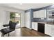 Bright kitchen area featuring white cabinetry, modern appliances, and a seamless transition to outdoor patio at 6838 Cherry Laurel Ln, Fishers, IN 46038