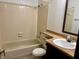 Bathroom with a tiled tub/shower combo and a single sink vanity at 7042 Colita More Ct, Indianapolis, IN 46254