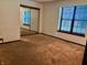 Cozy bedroom with natural light, plush carpet and a mirrored closet at 7042 Colita More Ct, Indianapolis, IN 46254