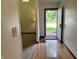 Bright entryway with tile flooring and view into carpeted living space at 7042 Colita More Ct, Indianapolis, IN 46254