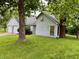 Home with two car garage, brick chimney and large front yard at 7042 Colita More Ct, Indianapolis, IN 46254