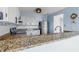 Bright kitchen features granite counters, white cabinets, and stainless steel appliances at 8158 Shorewalk Dr # F, Indianapolis, IN 46236