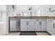 Updated kitchen with stainless steel dishwasher, granite countertops, and bright lighting at 8158 Shorewalk Dr # F, Indianapolis, IN 46236