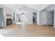 Bright living room with fireplace, hardwood floors, and easy access to kitchen and deck at 8158 Shorewalk Dr # F, Indianapolis, IN 46236
