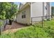 Backyard with a gravel patio and a chain link fence at 829 Pioneer Woods Dr, Indianapolis, IN 46224