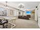 Finished basement with seating area, desk, media, recessed lights, and neutral carpeting at 829 Pioneer Woods Dr, Indianapolis, IN 46224