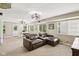 Basement sitting area with neutral carpeting and walls, ample lighting, with a nearby office visible at 829 Pioneer Woods Dr, Indianapolis, IN 46224