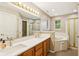 Bathroom with double sink vanity, garden tub, and separate shower at 829 Pioneer Woods Dr, Indianapolis, IN 46224
