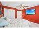 Well-lit bedroom showcasing closet space, comfortable bed, and a ceiling fan at 829 Pioneer Woods Dr, Indianapolis, IN 46224