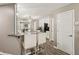 Modern kitchen featuring granite countertops, stainless steel appliances, and stylish bar seating, perfect for cooking and entertaining at 829 Pioneer Woods Dr, Indianapolis, IN 46224