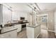 Beautiful kitchen with an island, stainless steel appliances, and white cabinetry, creating a modern and functional cooking space at 829 Pioneer Woods Dr, Indianapolis, IN 46224