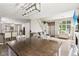 Open-concept living area with a fireplace, stylish furniture, and a staircase, perfect for entertaining and comfortable living at 829 Pioneer Woods Dr, Indianapolis, IN 46224
