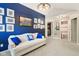 Comfortable living room features blue accent wall, plush seating and ample natural light at 829 Pioneer Woods Dr, Indianapolis, IN 46224